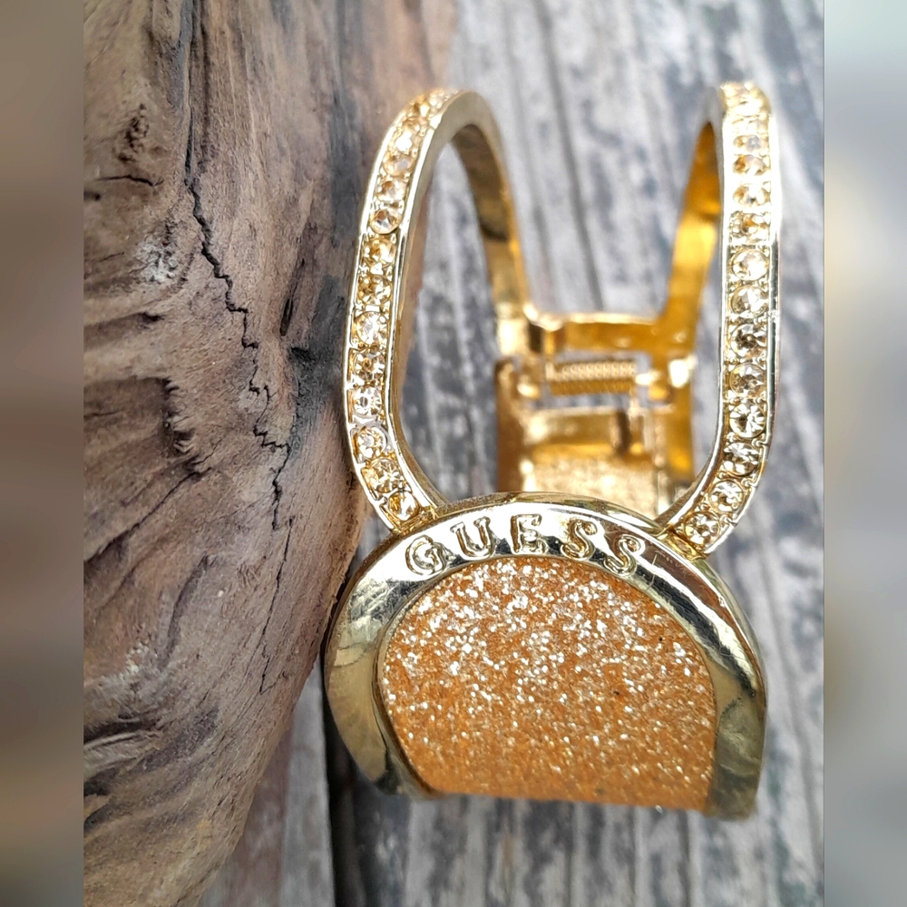 GUESS CLAMPER GOLD TONE BRACELETE 2.5" WIDE